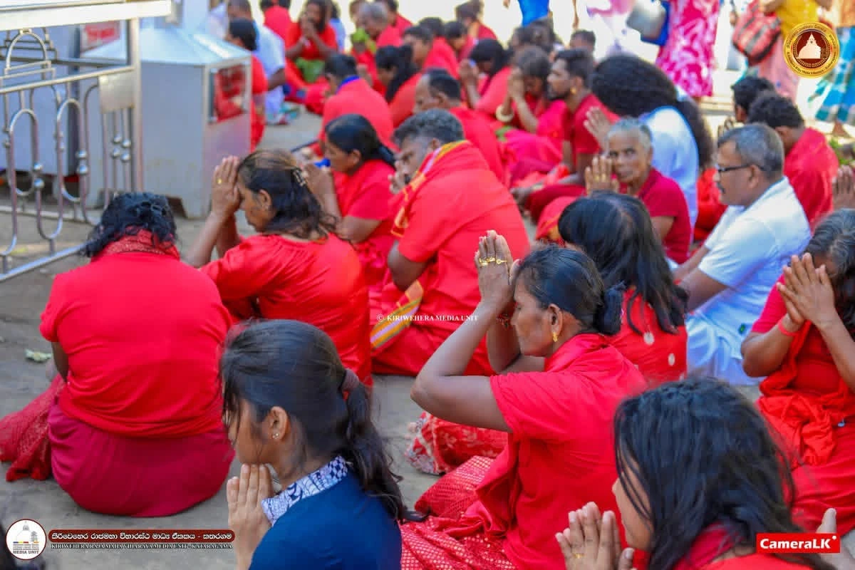 Devotees participating in the fire ritual receive the blessings of the Kirivehera Raja Maha Viharaya